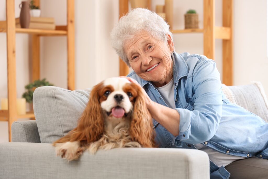 senior with dog The Benefits of Pet Therapy for Older Adults Living with Dementia